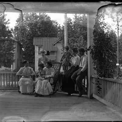 Family gathering on porch/GP1.3687
