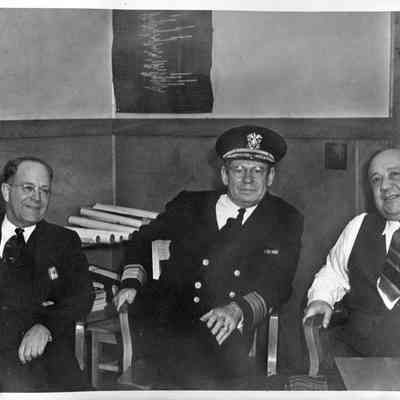 James C. Merrill, Rear Admiral Howard L. Vickery (vice chairman of the U.S. Maritme Commission), L.F. Fisher. March 1943