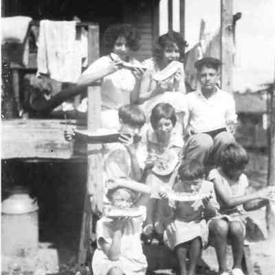 Helen Barket eating watermelon with friends, 1926.