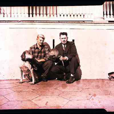 Armadillo with 2 men and a dog