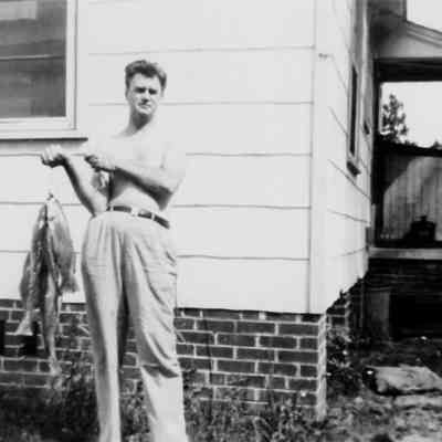 Olin Wolfe with fish, late 1940s..