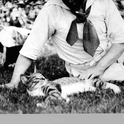 G.B. Scott with Cat on Grass, 1915