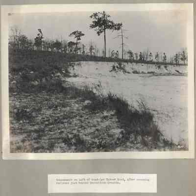 Embankment on left of road Lem Turner Road after crossing railroad just bey