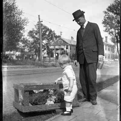 Joe Costa with chickens in a crate/GP1.1849