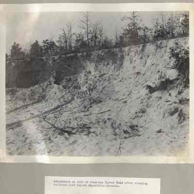 Embankment on left of road Lem Turner Road after crossing railroad just bey