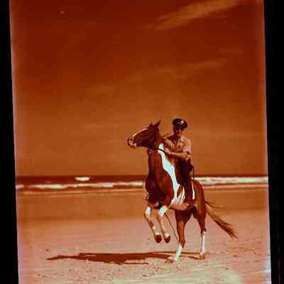 Man on Horseback on Beach