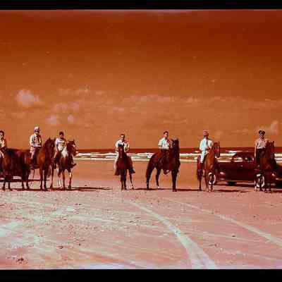 Group on Horseback on Beach