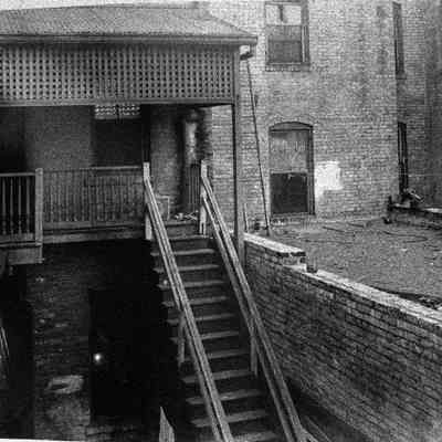 back between Julia and Cedar Streets on right side Forsyth Street Going Wes