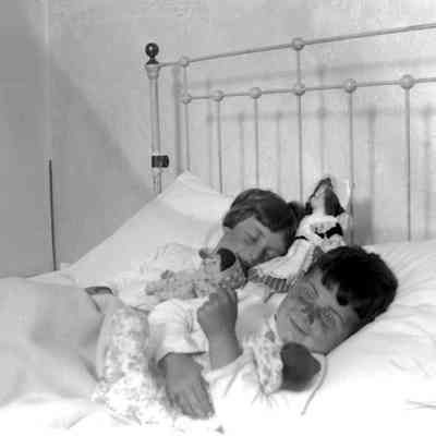 Leah Mary Cox photograph of two children in bed