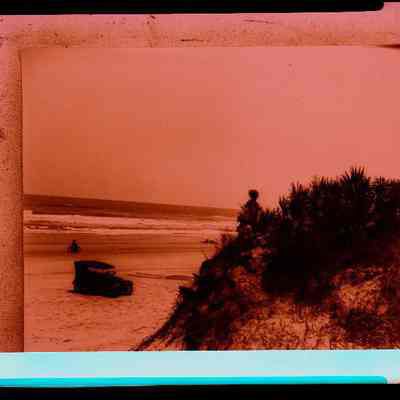 Person on Dune/Car & bicycle on Beach