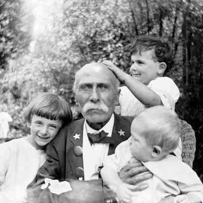 Leah Mary Cox photograph of a veteran and children
