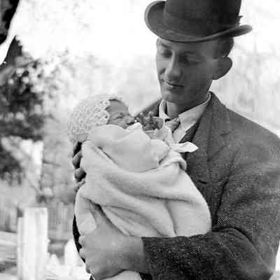 Leah Mary Cox photograph of a man cradling a baby