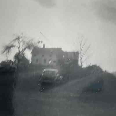 Hopper Valley Road homes being torn down in 1952. Height of Old Valley Road can be seen on the right side of the home