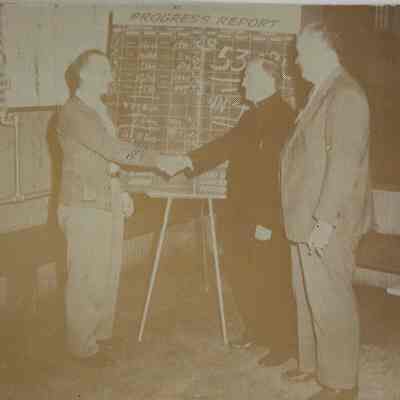 Two teachers shaking hands