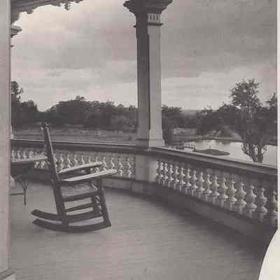 Partial photograph composite rocking chair on porch