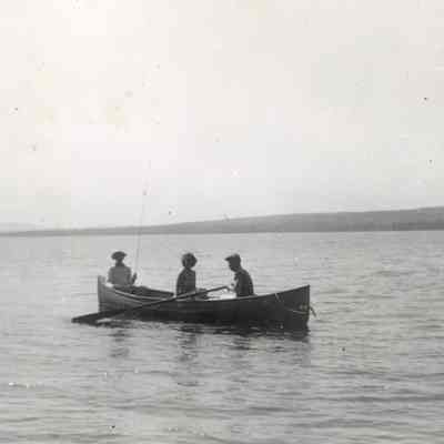 Young Family Boating on a Lake