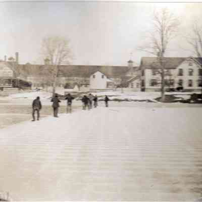 Cutting Blocks of Ice with Havemeyer barns in background.