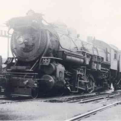 Erie #3127 taking water and with freight