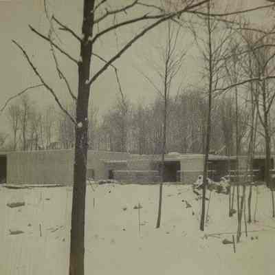 A photo of the back of the school, with snow on the ground