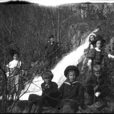 Children near a waterfall