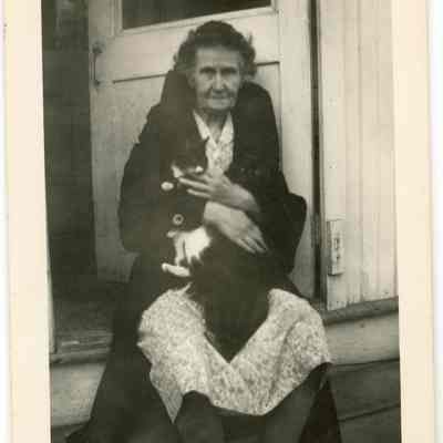 Anna Jane Bodine Young holding cats