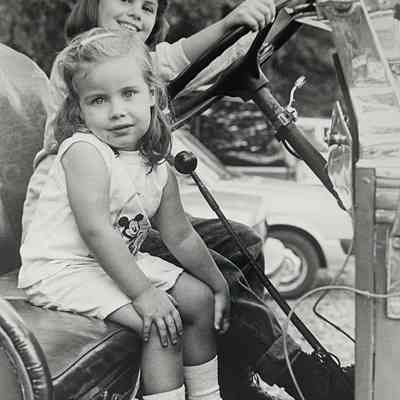 Alison Dinapoli and Kim Nifores have fun in the driver's seat of the old fire engine on display