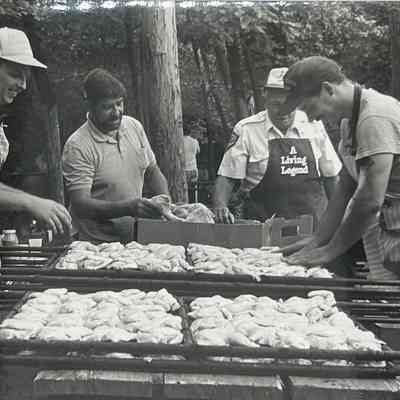 John Krawczyk, Ken Osborne, Andy Rozanski, and Dave Markstein prepare the chicken for the barbecue