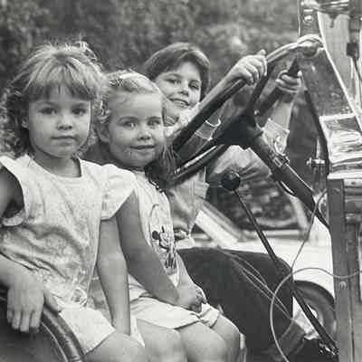 Katie Tylutki, Alison Dinapoli, and Kim Nifores (at steering wheel) played firemen in the old fire engine on display at the annual Mahwah Fire Company No.3 Chicken Barbecue Dinner at which fun was had by all.