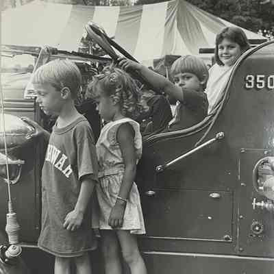 Matt Dillon, Kim Nifores, Katie Tylutki, and Tim Brazik (at steering wheel) enjoy playing on the firetruck