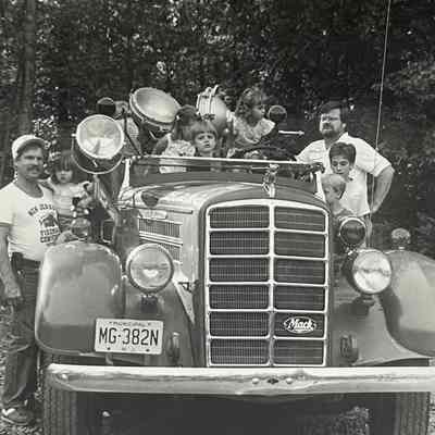 The old Mahwah fire engine that was on display at the recent annual Fire Company #3 Chicken Barbecue was enjoyed by many youngsters with parents, such as Co.1 Fireman Jeff smith (left) with his daughter Kristina, keeping an eye on the "young firemen"