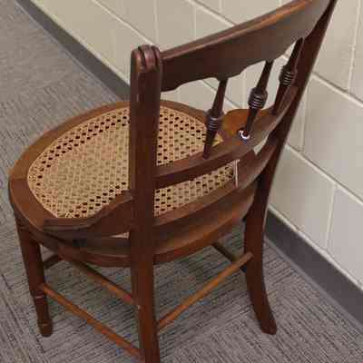 3/4 view of caned seat side chair from back: Photo by Michael Thurston