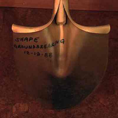 Back side of the groundbreaking ceremonial shovel with details written with indelible marker on the upper left of the shovel blade.