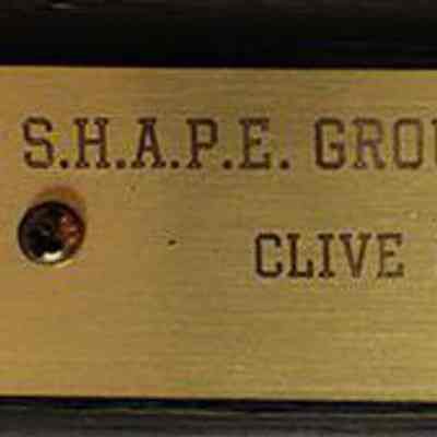 Engraved plate attached to the shovel handle commemorating the groundbreaking.