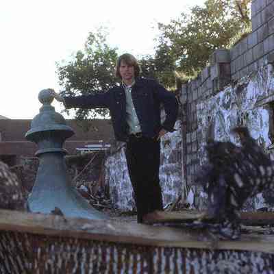 Russell Bailas ’74, pictured within the debris field of Vail Mansion: Russell Bailas selfie, fall 1974