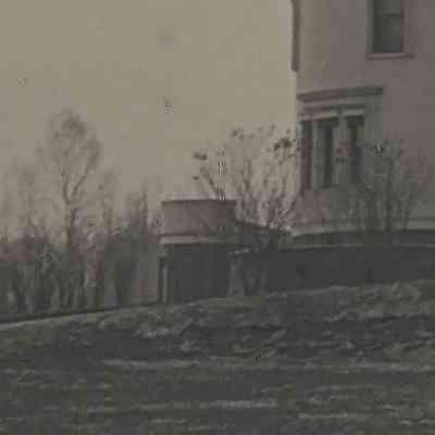 Enlargement of unknown structure south of Vail Mansion: This is our area of interest. In all of our photographs of Vail Mansion, there is no other photograph that shows this additional structure south of the mansion. It appears to be a cylindrical structure with a domed roof with yet another building behind it, or perhaps the cylindrical structure is attached to the additional structure. If anyone has information regarding this other structure, please contact Vail Museum with details.