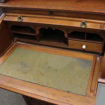 Detail inside roll-top desk with writing surface extended: Photo by Michael Thurston