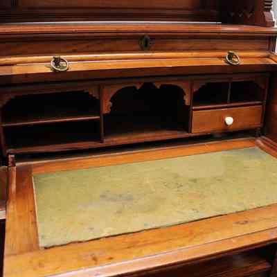 Additional detail inside roll-top desk with writing surface extended: Photo by Michael Thurston