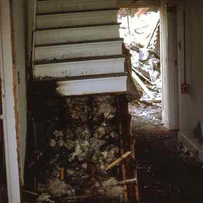 The burned out stairs rescuers of the balustrade had to overcome to achieve their goal in October 1974: Photo of the arson fire by Russell Bailas ’74