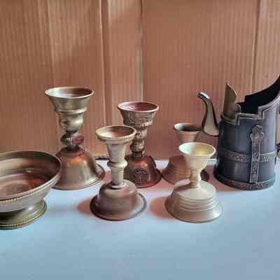 Five butter lamps, pitcher, and dish
