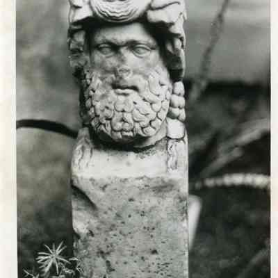 Carved Stone Pedestal with Bearded Man's Head