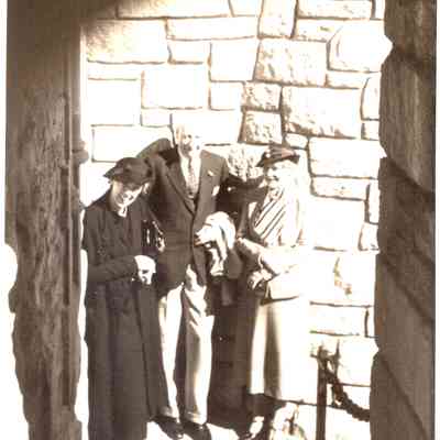 man & 2 ladies on oceanside stairs
