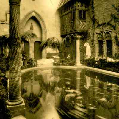 1929 ca JHHJr in monk robe in courtyard