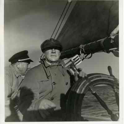 JHHJr At wheel on schooner