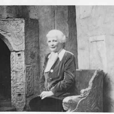 1952 ca Irene R F Hammond on courtyard seat