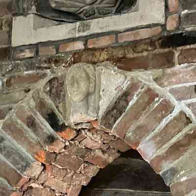 Stone Woman's Head (within doorway arch)