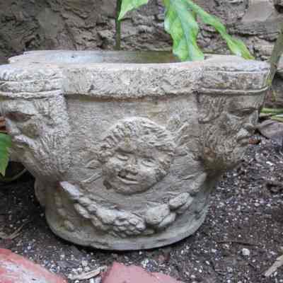 Carved Stone Basin with Men's Face at Corners & Cherub Faces on Sides