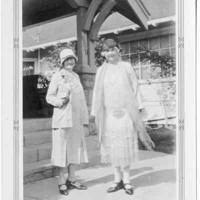 2 ladies at porch steps (signed Christmas Greetings)