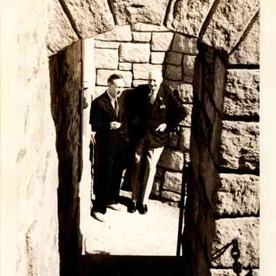 1930s ca Hammond & older man on ocean lawn stairs