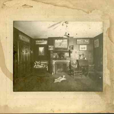 unknown room with fireplace & animal rug