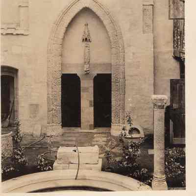1930 ca HM404 sarcophagus at head of courtyard pool w hose & dirt floor